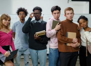 Men and women standing besides each other