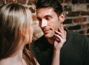 Man mysteriously looking at woman.